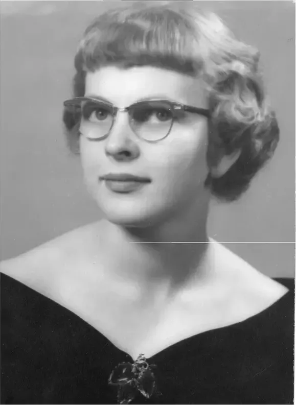 A treasured black-and-white photograph, worn with time, before being restored