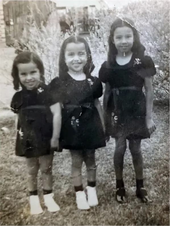 A treasured black-and-white photograph, worn with time, before being restored