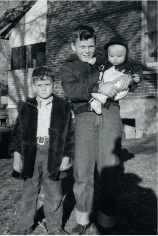 A treasured black-and-white photograph, worn with time, before being restored