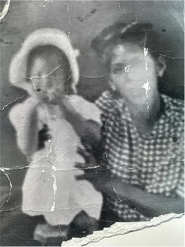 Old black-and-white photograph showing its age, before photo restoration