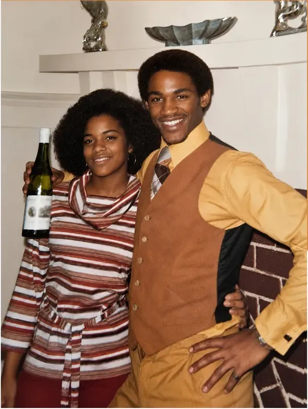 The same 1950s-1970s photograph after hand restoration by MemoryCherish, discoloration repaired and detail recovered
