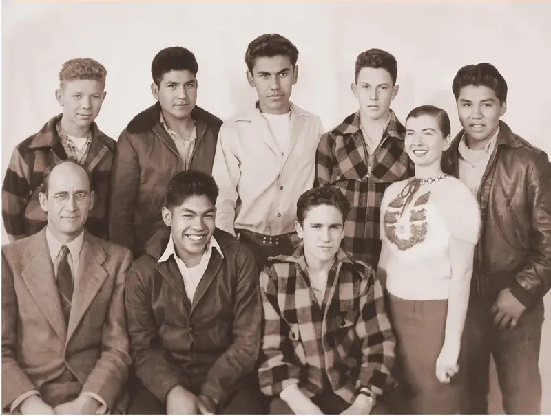 The same 1950s-1970s photograph after hand restoration by MemoryCherish, creases and tears repaired and detail recovered