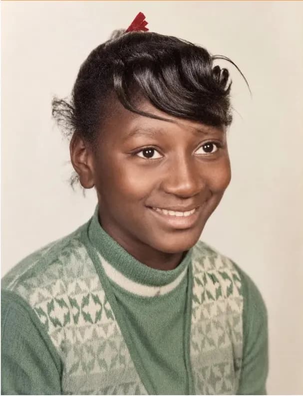 The same 1950s-1970s photograph after hand restoration by MemoryCherish, creases and tears repaired and detail recovered