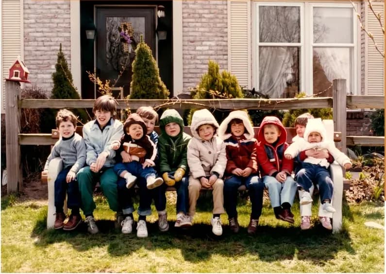 The same 1980s-plus photo restored by hand at MemoryCherish, discoloration corrected and clarity brought back