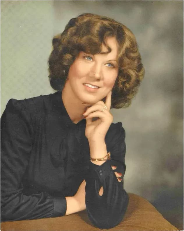 This discoloured photograph had faded and worn before restoration