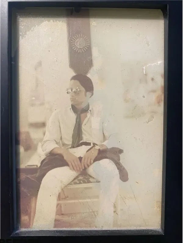 Scratches on a photograph, before hand restoration by MemoryCherish artists
