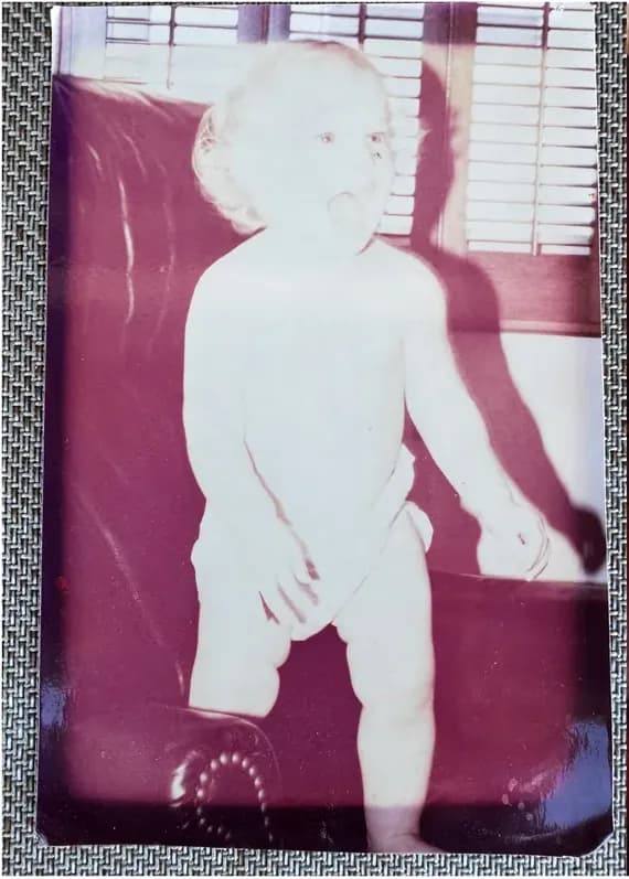 Creases and tears on a 1950s-1970s photograph, before hand restoration by MemoryCherish artists