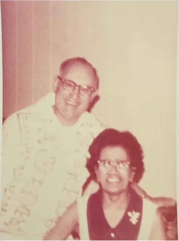 A treasured discoloured photograph, worn with time, before being restored