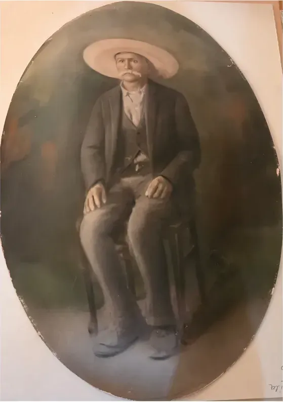 A treasured faded photograph, worn with time, before being restored