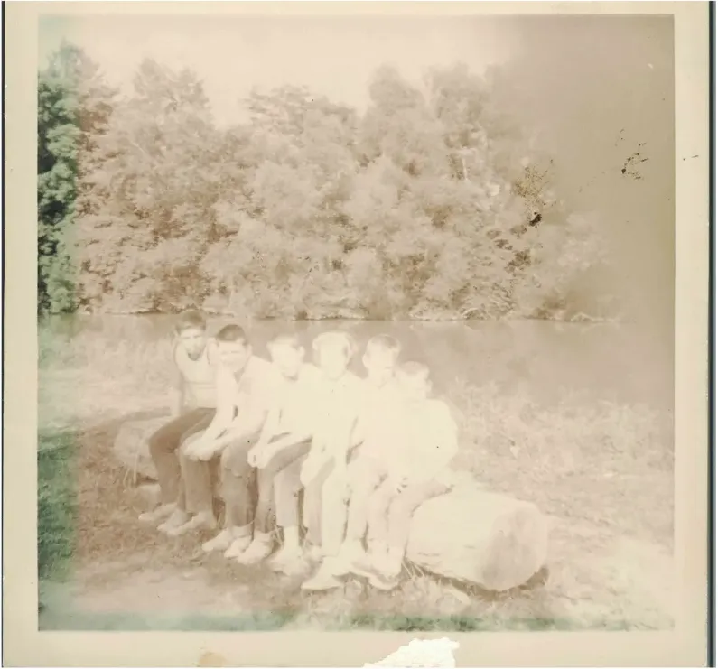 Water damage on a 1950s-1970s photograph, before hand restoration by MemoryCherish artists