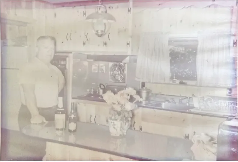 A treasured faded photograph, worn with time, before being restored