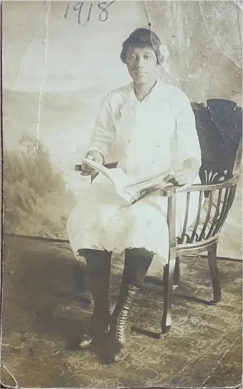 A treasured faded photograph, worn with time, before being restored