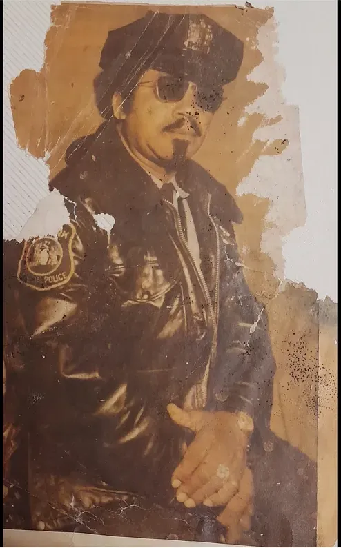 Torn and creased photograph sent to MemoryCherish for expert photo restoration