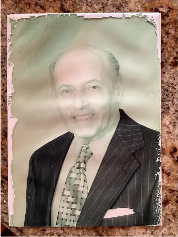 Old torn and creased photograph showing its age, before photo restoration