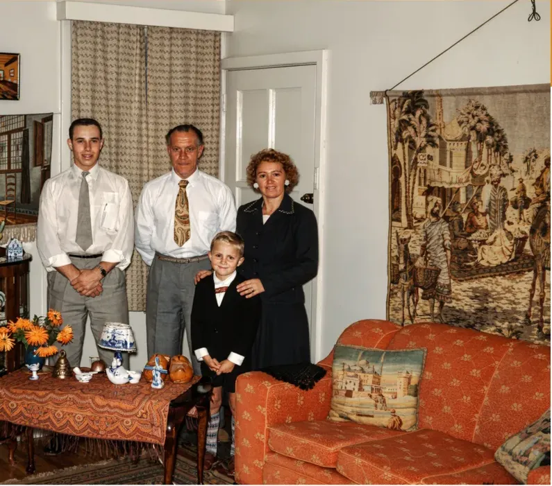 The same 1950s-1970s photograph after hand restoration by MemoryCherish, discoloration repaired and detail recovered