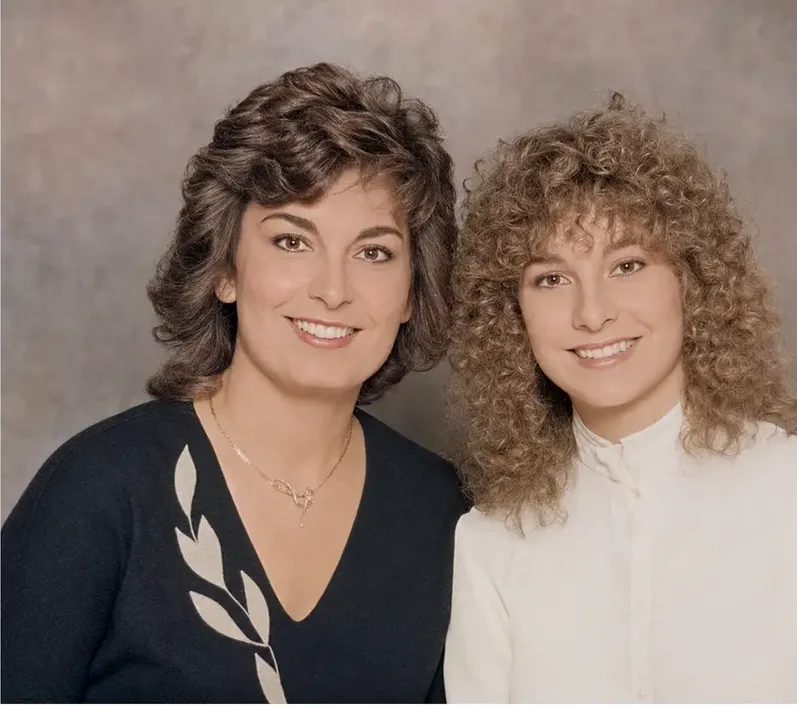 The same 1980s-plus photograph after hand restoration by MemoryCherish, discoloration repaired and detail recovered