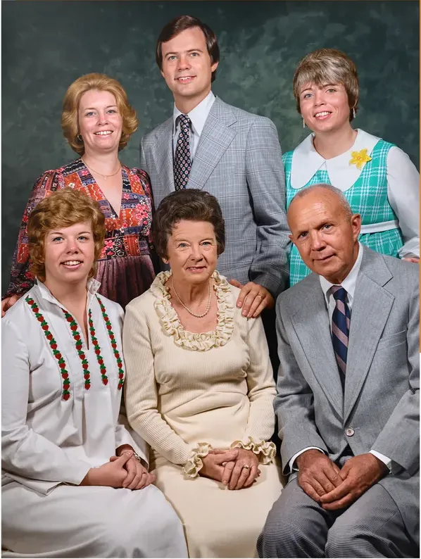 The same 1950s-1970s photograph after hand restoration by MemoryCherish, discoloration repaired and detail recovered