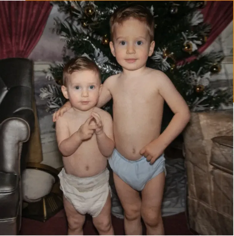 The same 1950s-1970s photo restored by hand at MemoryCherish, creases and tears corrected and clarity brought back