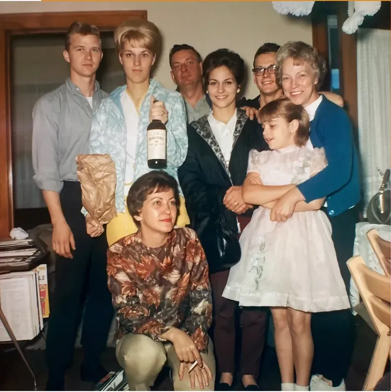 The same 1950s-1970s photograph after hand restoration by MemoryCherish, creases and tears repaired and detail recovered