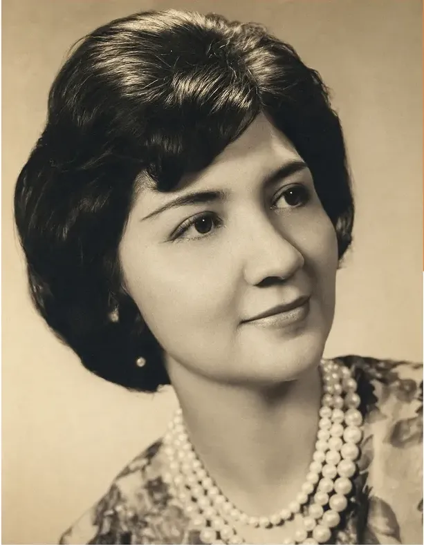 The same 1950s-1970s photograph after hand restoration by MemoryCherish, creases and tears repaired and detail recovered