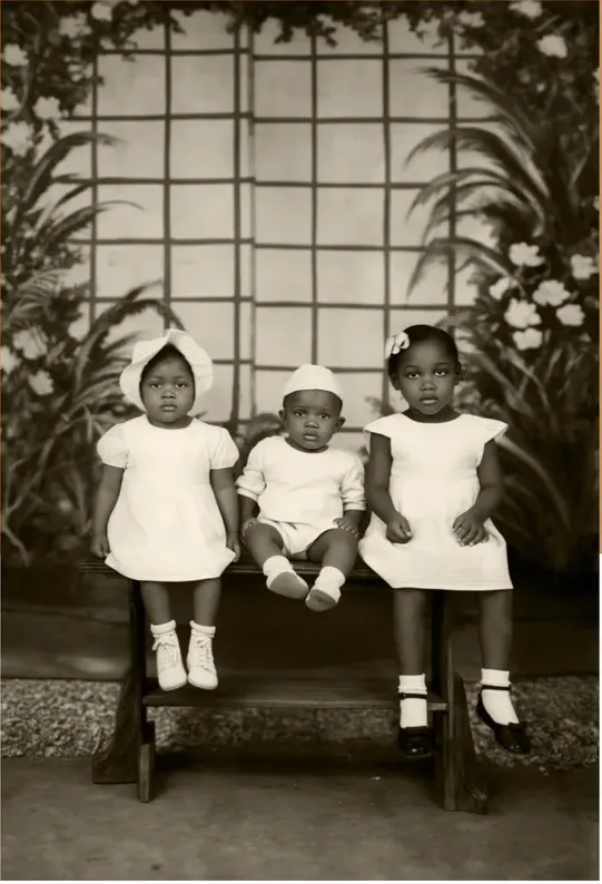 The same 1950s-1970s photo restored by hand at MemoryCherish, water damage corrected and clarity brought back