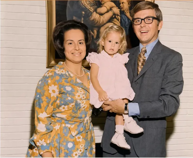 The same 1950s-1970s photograph after hand restoration by MemoryCherish, creases and tears repaired and detail recovered