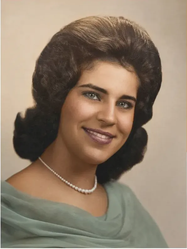 The same 1950s-1970s photo restored by hand at MemoryCherish, water damage corrected and clarity brought back