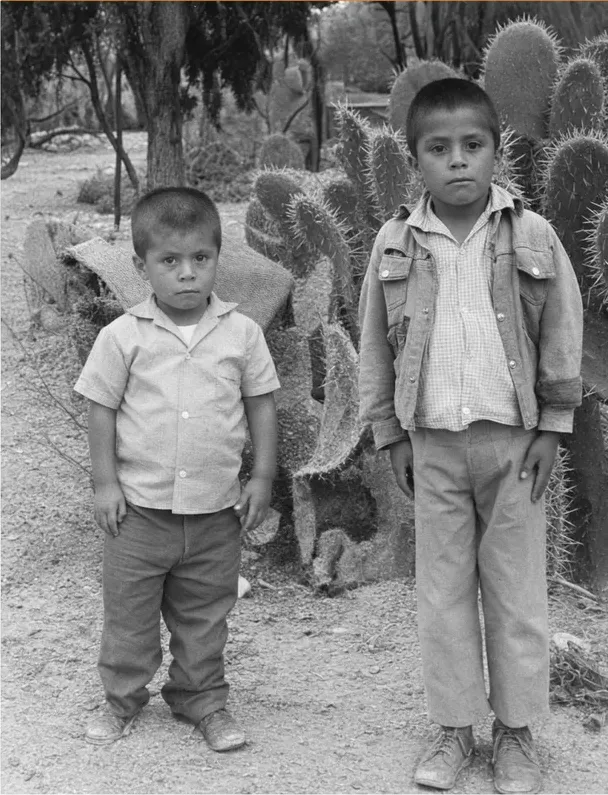 The same 1950s-1970s photo restored by hand at MemoryCherish, creases and tears corrected and clarity brought back