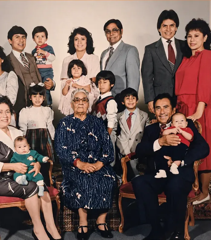 The same 1980s-plus photograph after hand restoration by MemoryCherish, discoloration repaired and detail recovered