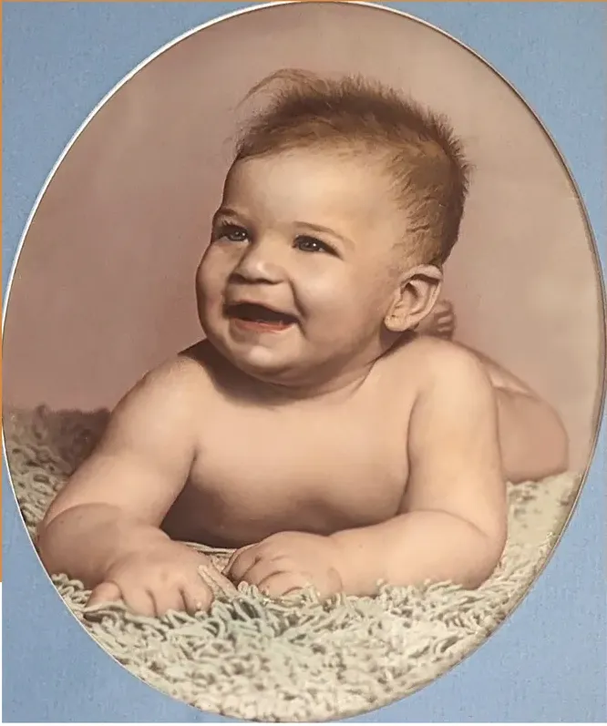 The same 1950s-1970s photo restored by hand at MemoryCherish, creases and tears corrected and clarity brought back