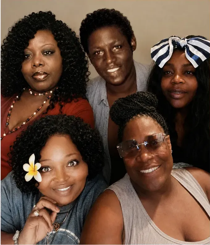 The same 1980s-plus photo restored by hand at MemoryCherish, stains and marks corrected and clarity brought back