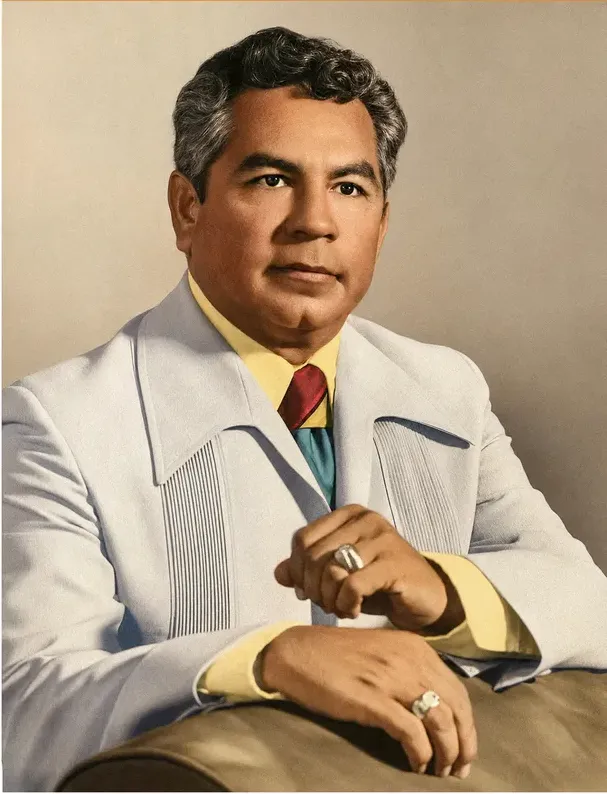 The same 1950s-1970s photograph after hand restoration by MemoryCherish, creases and tears repaired and detail recovered