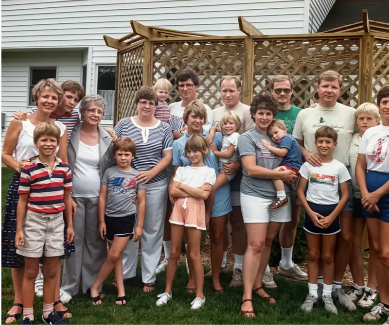 The same 1980s-plus photo restored by hand at MemoryCherish, discoloration corrected and clarity brought back