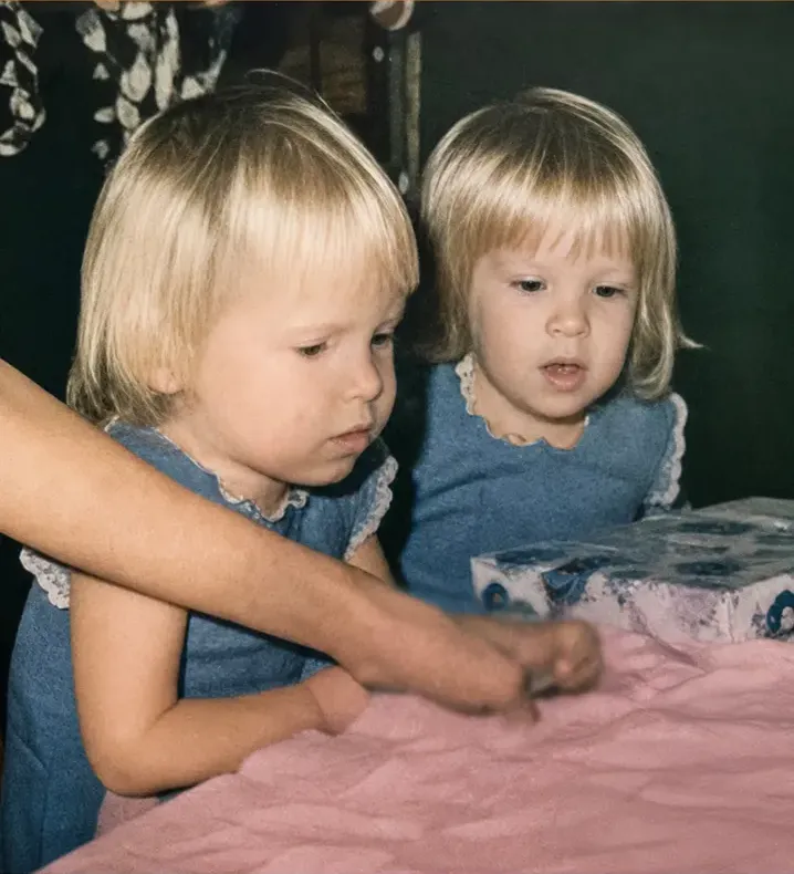 The same 1950s-1970s photograph after hand restoration by MemoryCherish, discoloration repaired and detail recovered