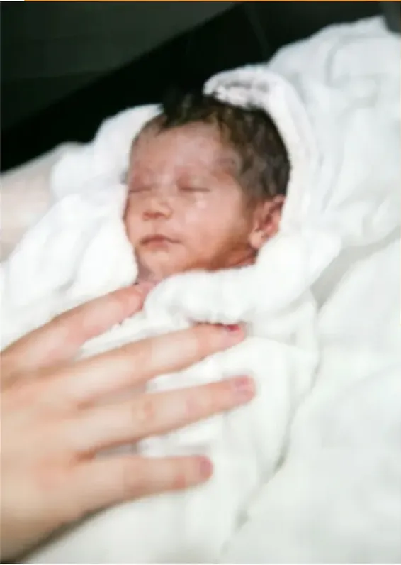 The same 1980s-plus photo restored by hand at MemoryCherish, discoloration corrected and clarity brought back
