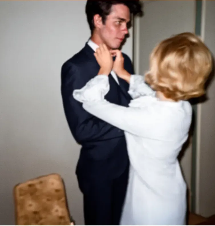 The same 1950s-1970s photograph after hand restoration by MemoryCherish, discoloration repaired and detail recovered