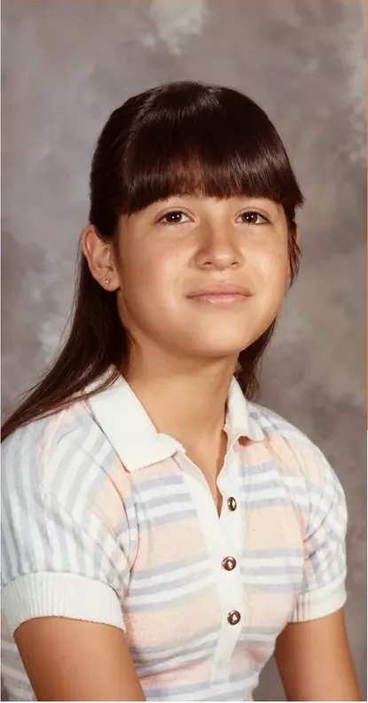 The same 1950s-1970s photograph after hand restoration by MemoryCherish, creases and tears repaired and detail recovered