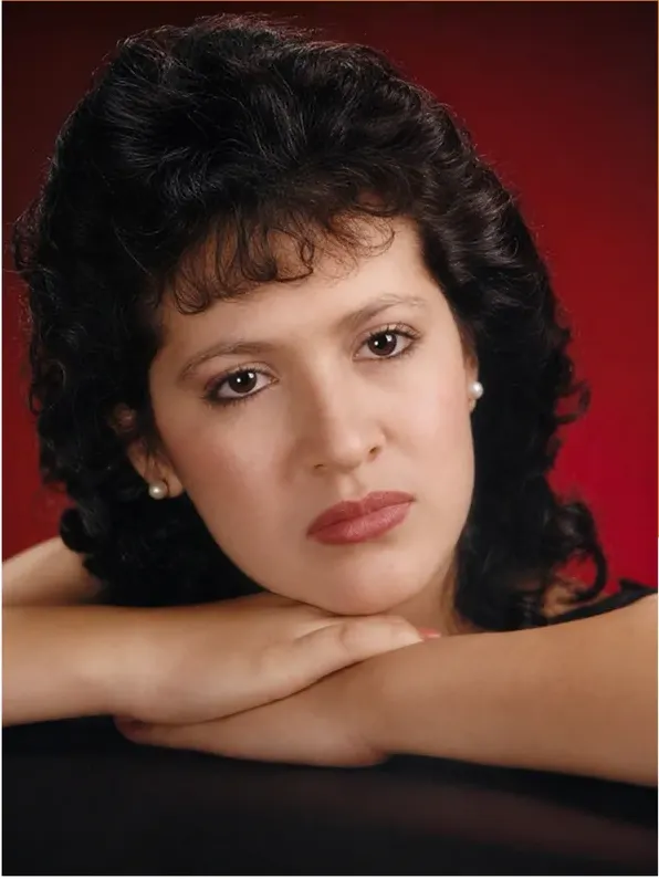 The same 1980s-plus photo restored by hand at MemoryCherish, scratches corrected and clarity brought back