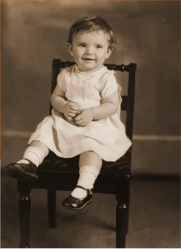 The same pre-1950 photo restored by hand at MemoryCherish, creases and tears corrected and clarity brought back