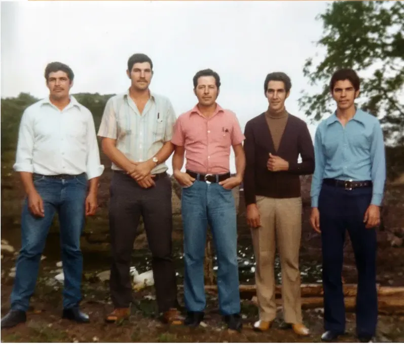 The same 1950s-1970s photograph after hand restoration by MemoryCherish, creases and tears repaired and detail recovered