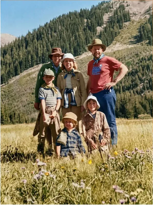 The same 1950s-1970s photo restored by hand at MemoryCherish, water damage corrected and clarity brought back