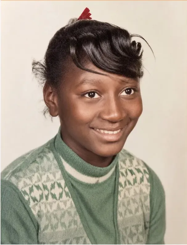 The same 1950s-1970s photograph after hand restoration by MemoryCherish, creases and tears repaired and detail recovered