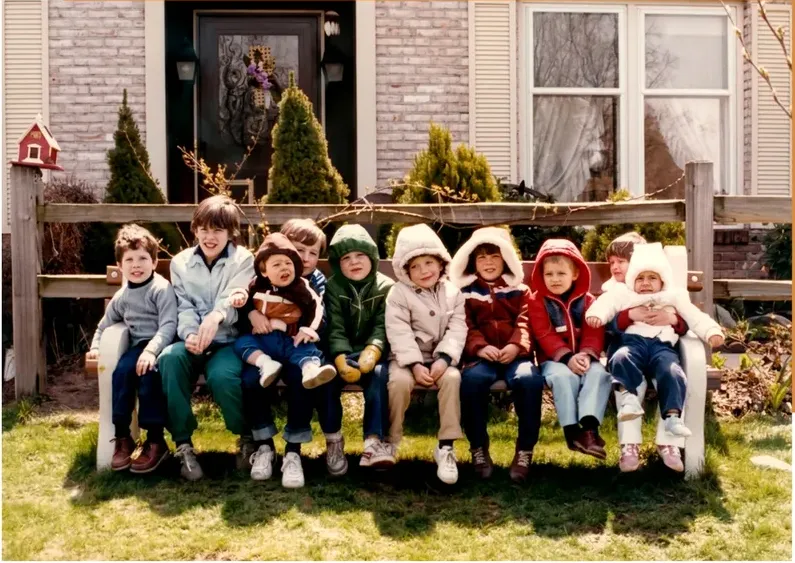 The same 1980s-plus photo restored by hand at MemoryCherish, discoloration corrected and clarity brought back
