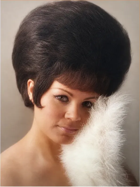 The same 1950s-1970s photograph after hand restoration by MemoryCherish, stains and marks repaired and detail recovered