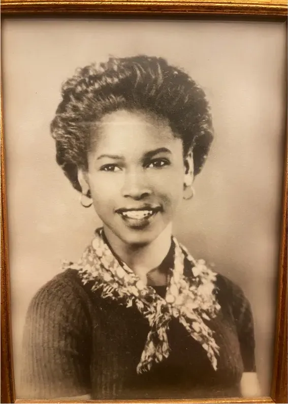 Discoloration on a pre-1950 photograph, before hand restoration by MemoryCherish artists