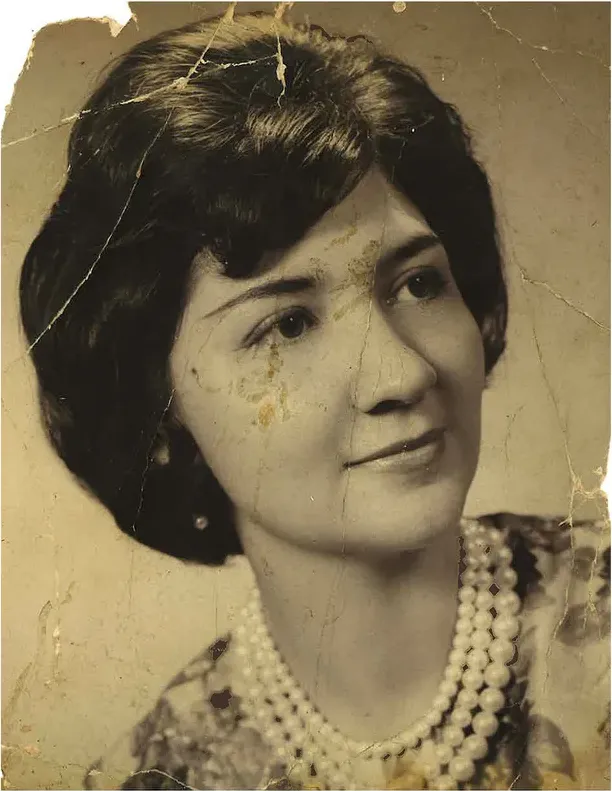 Creases and tears on a 1950s-1970s photograph, before hand restoration by MemoryCherish artists