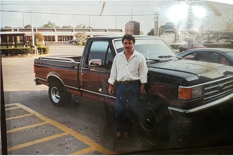 Water damage on a 1980s-plus photograph, before hand restoration by MemoryCherish artists