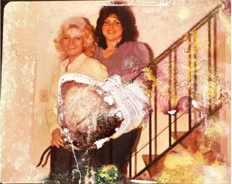 Water damage on a 1980s-plus photograph, before hand restoration by MemoryCherish artists