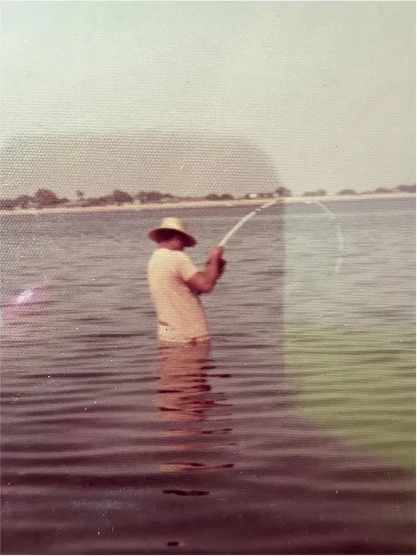 Water damage on a 1950s-1970s photograph, before hand restoration by MemoryCherish artists