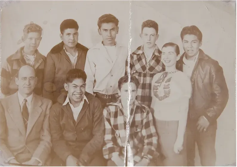 Creases and tears on a 1950s-1970s photograph, before hand restoration by MemoryCherish artists